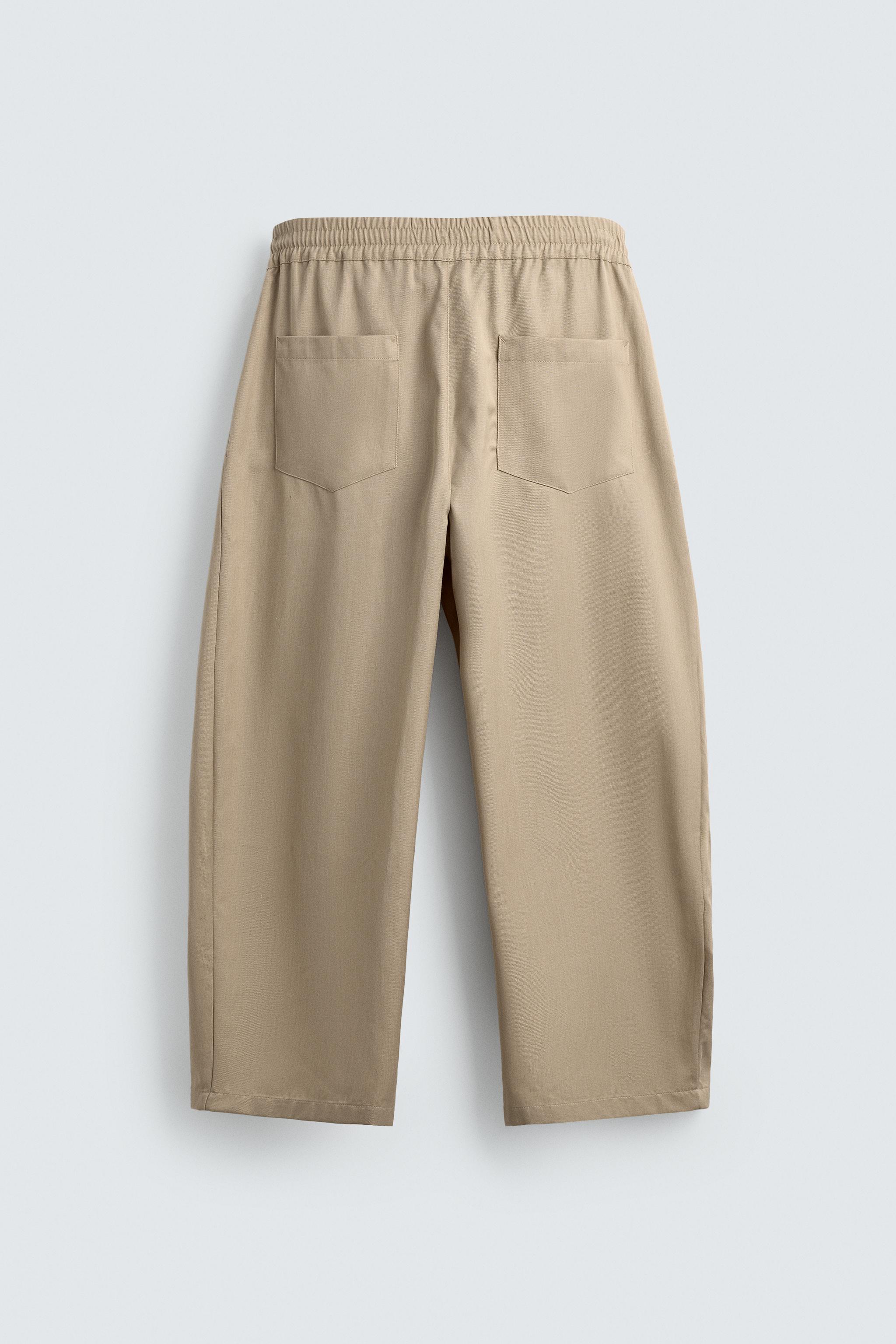 PLEATED BALLOON FIT PANTS